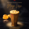 Brass container glass of Mango Lassi by Anmol Sweets sTockholm with fresh mangoes